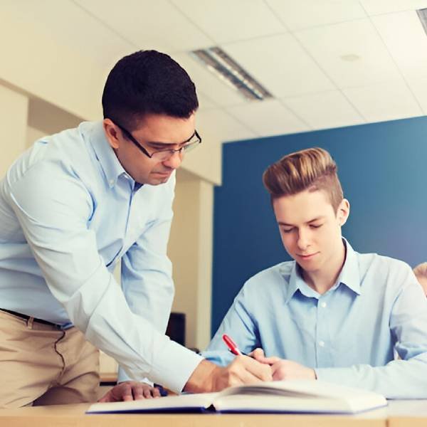 Group of students and teacher at school classroom